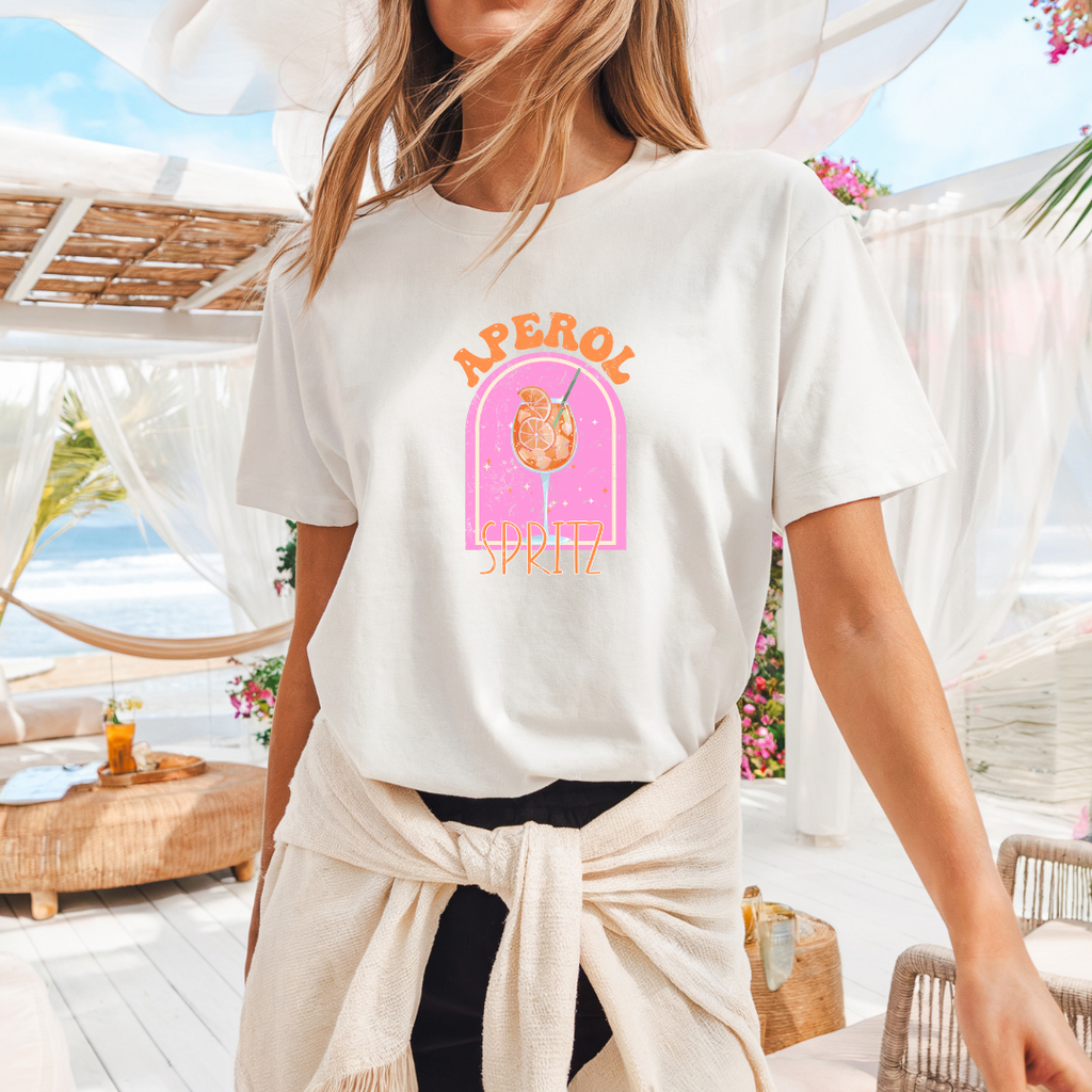 Camiseta casual de corte holgado con cuello redondo, manga corta, 100% Algodón, con gráfico de Aperol. Perfecta para el estilo diario.