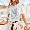 Camiseta casual de corte holgado con cuello redondo, manga corta, 100% Algodón, con gráfico de Conchas Marinas. Perfecta para el estilo diario.