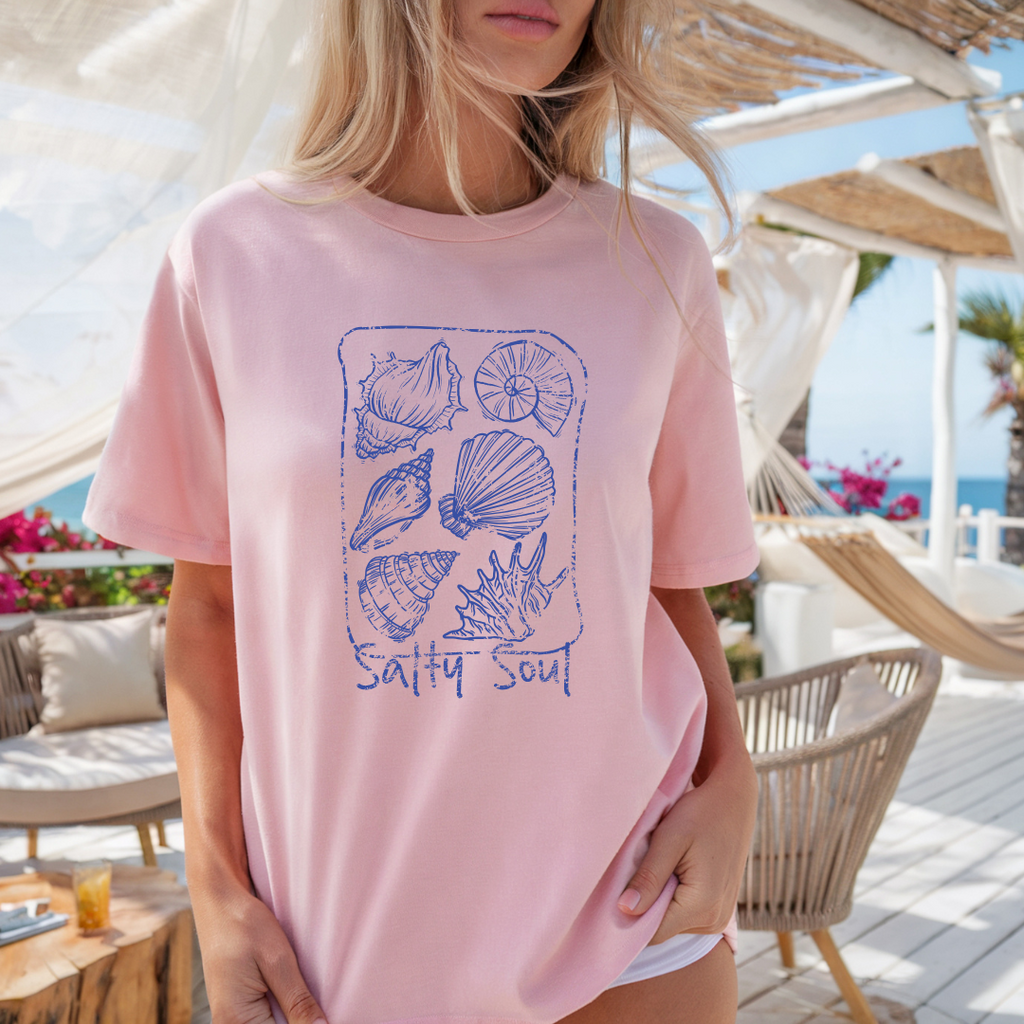 Camiseta casual de corte holgado con cuello redondo, manga corta, 100% Algodón, con gráfico de Conchas Marinas. Perfecta para el estilo diario.